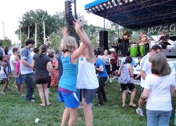 People dance to the infectious beats of Poncho Sanchez. [Photo by Jesse Starita]