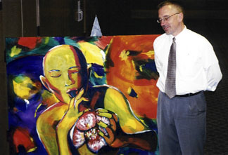 TPAC Assistant Director Mark Radziejeski with official 2005 Topeka Jazz Festival painting by a local Topeka artist. [Photo by Rich Hoover]