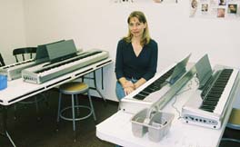 Vicki Harris of Harris Music Studio teaches group lessons in this keyboard lab. [Photo by Tom Ineck]